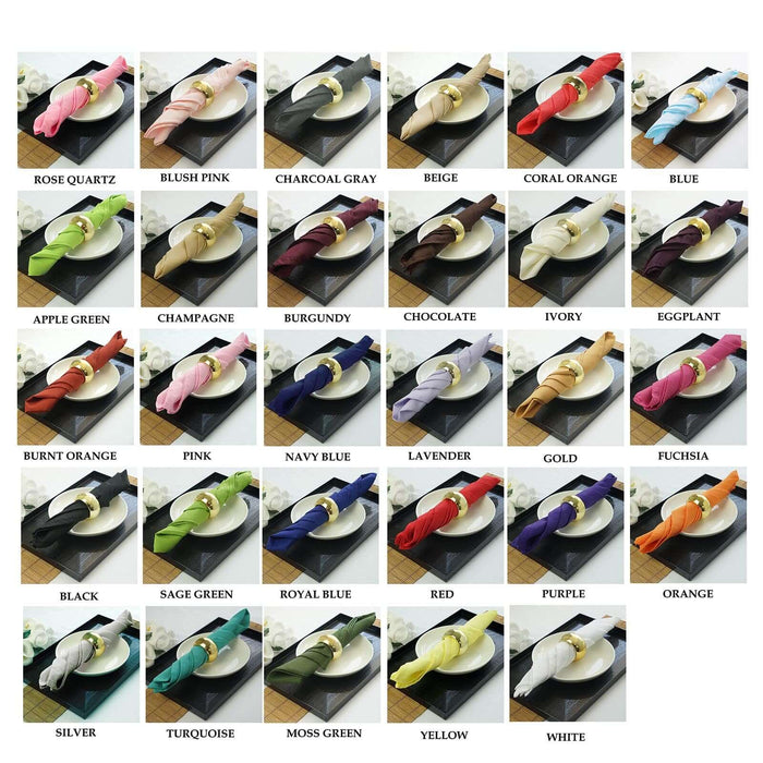 Variety of elegant napkin rings in assorted colors on black plates