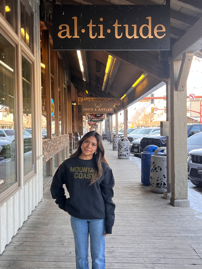 Woman wearing Luxe: Mountain Coast sweatshirt in charcoal