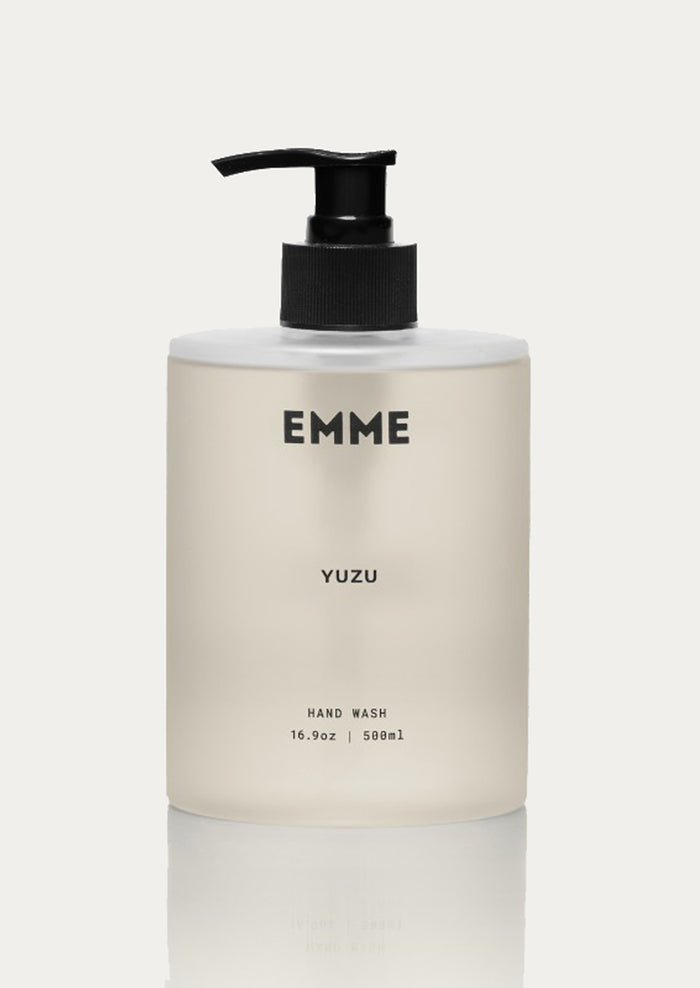 Hand wash bottle labeled 'EMME YUZU' on a light background