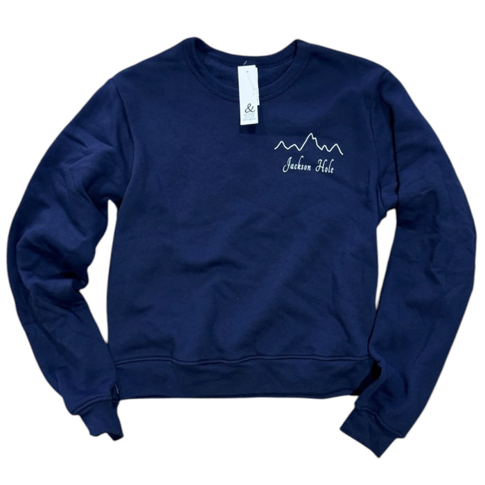 A navy sweatshirt with a mountain range design and the text 'Jackson Hole' on the front.