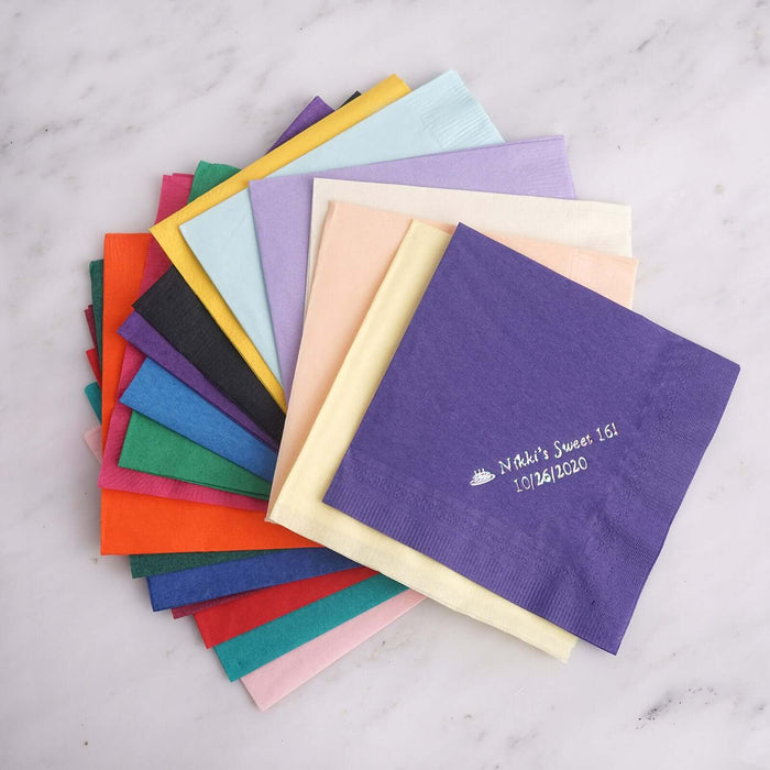 Colorful assortment of paper napkins in various shades and sizes.