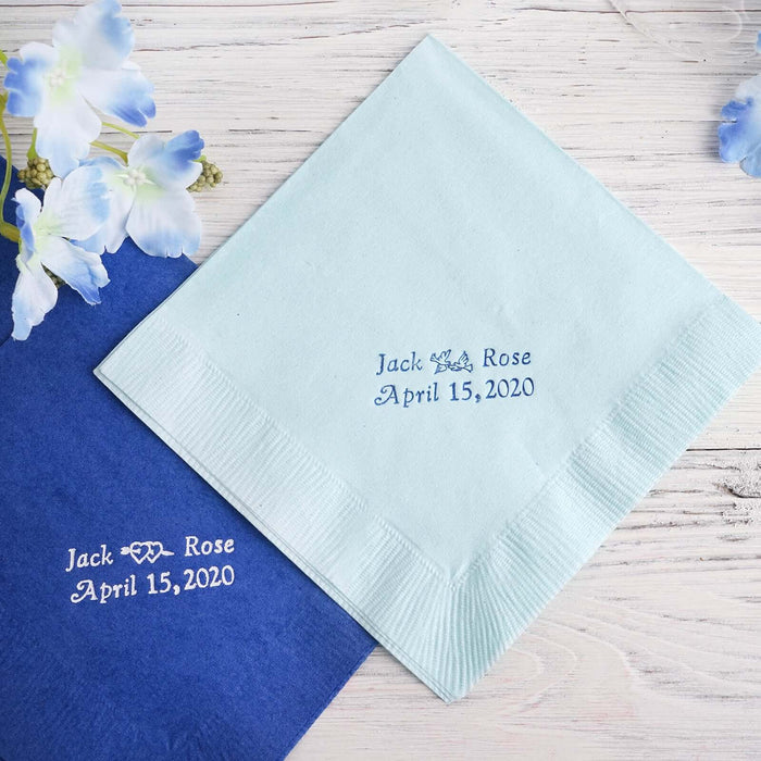 Personalized wedding napkins in blue and mint green with custom text.