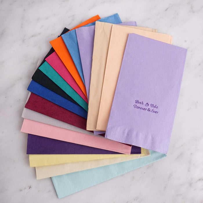Assorted colored napkins featuring custom embroidery design.