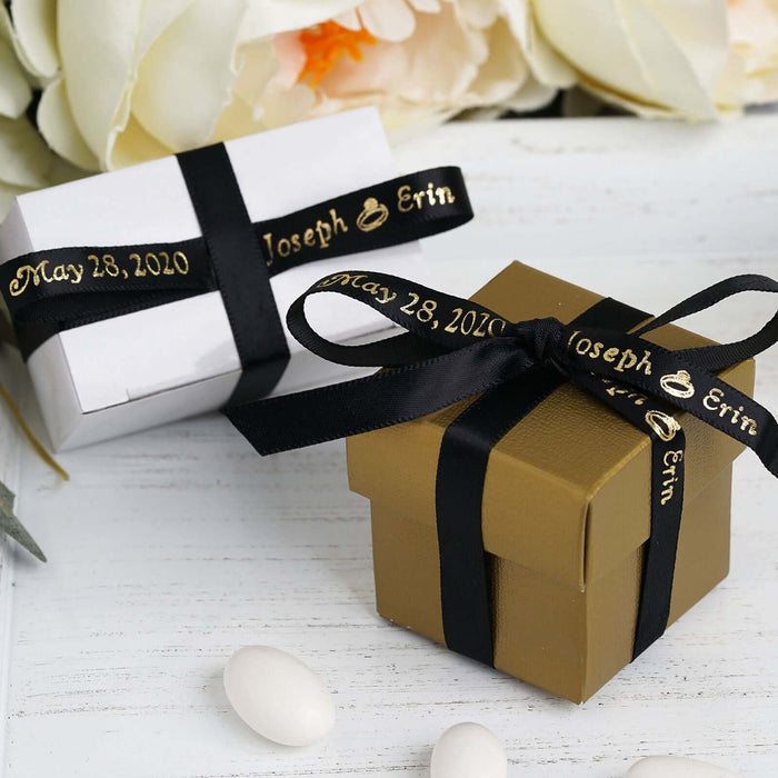 Gold and white gift boxes tied with elegant ribbons against a light background.