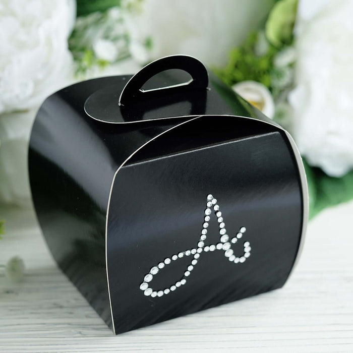 Black gift box with decorative rhinestone letter "A" design.