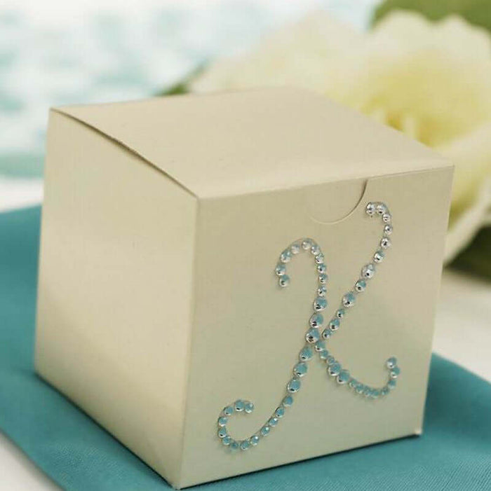 Decorative gift box with rhinestone accents and elegant design.