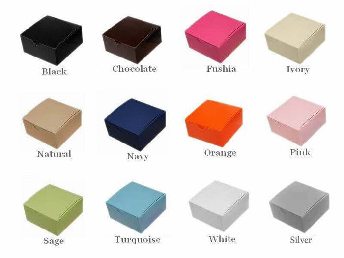 Colorful assorted gift boxes in various shades: black, chocolate, fuchsia, ivory, and more.