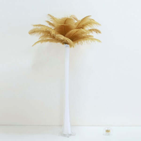 Artificial pampas grass in a tall, elegant vase.