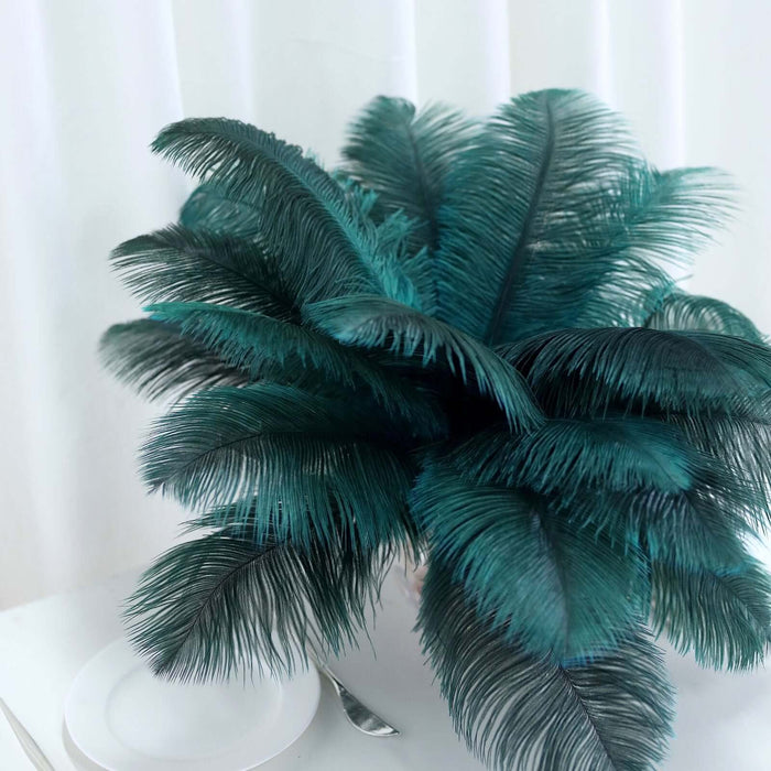 Teal artificial plant in a white pot against a plain background.