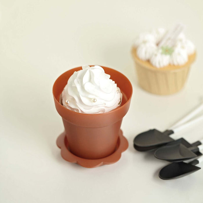 Brown dessert cup with whipped cream and spoons on a light background.