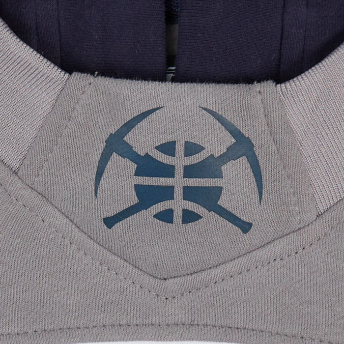Close-up of a dark navy basketball and pickaxe icon patch located on the gray hood of the hoody