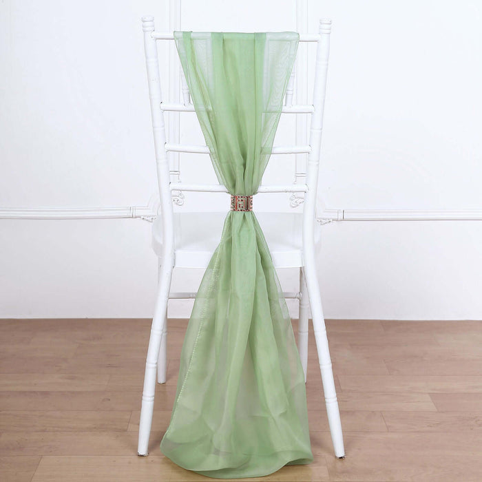 Green sheer chair sash draped elegantly on a white chiavari chair.