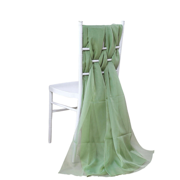 Green chiffon draped elegantly over a white chair back