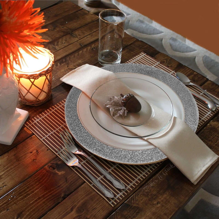 Elegant dining table setting with decorative plate and glassware.