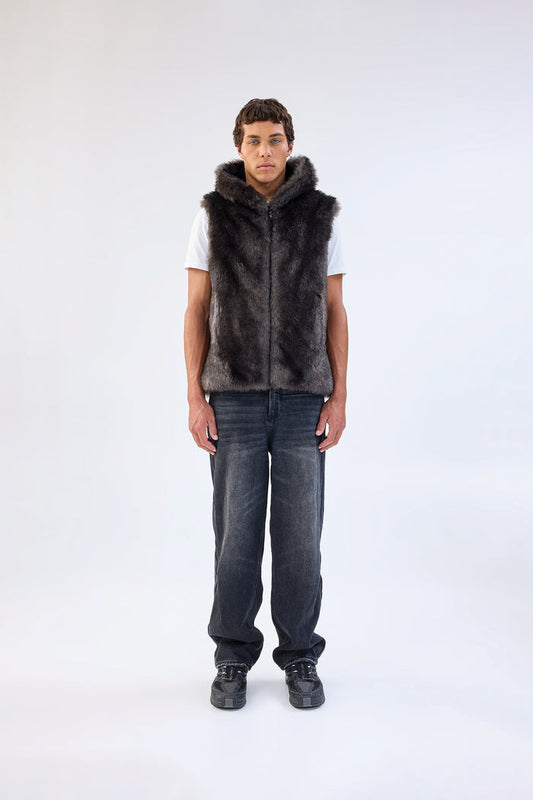 Dark grey faux fur hooded vest, worn over a white t-shirt and dark wash jeans, front view