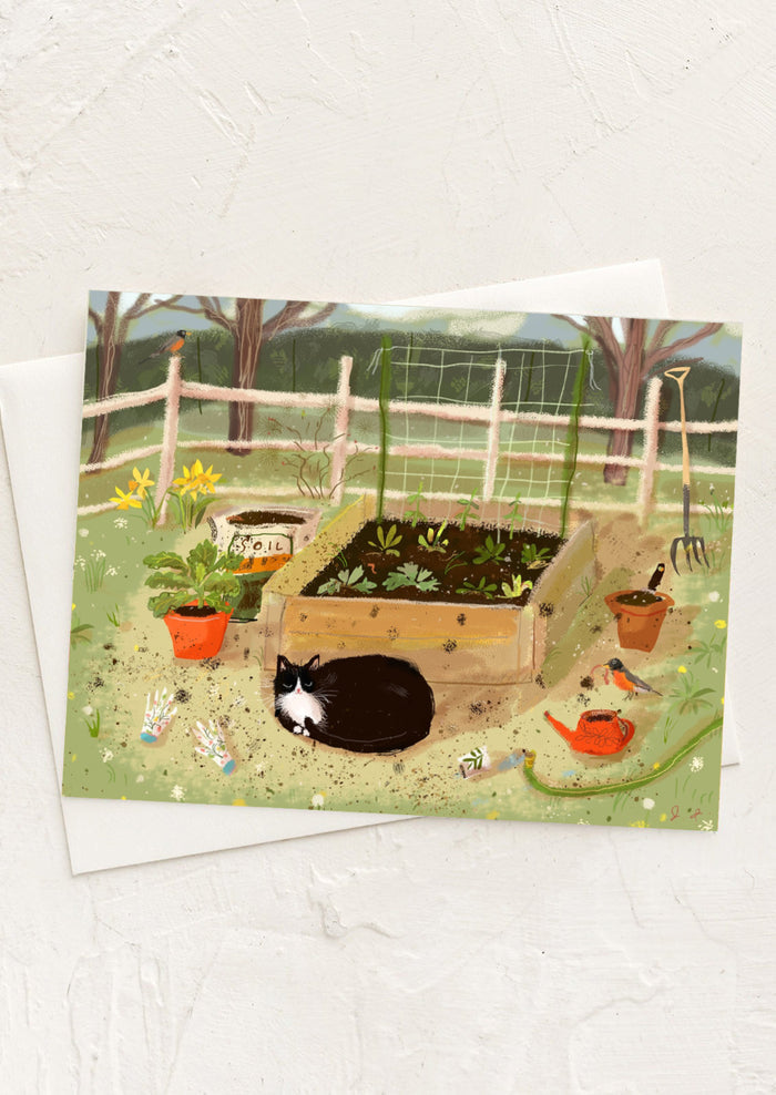 Greeting card with a garden scene featuring a cat, plants, and a fence.