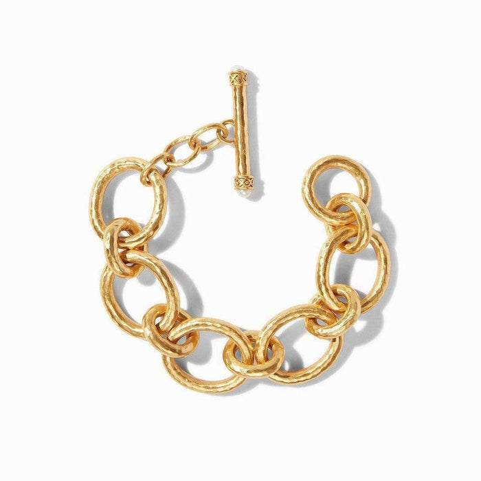 Gold hammered metal link bracelet with pearl accents.