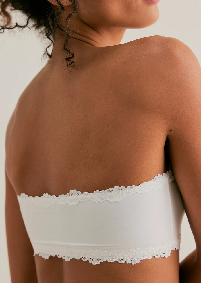 White bandeau with lace detail on a plain background, back view