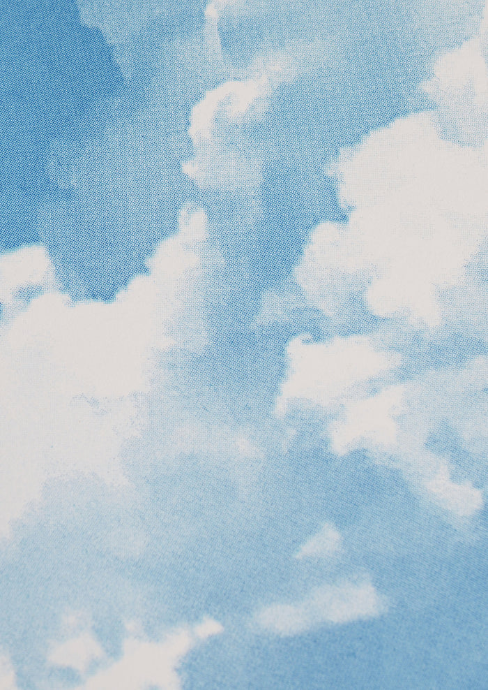 Close-up of fluffy white clouds against a light blue sky