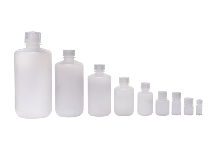 Set of white plastic bottles of various sizes on a white background