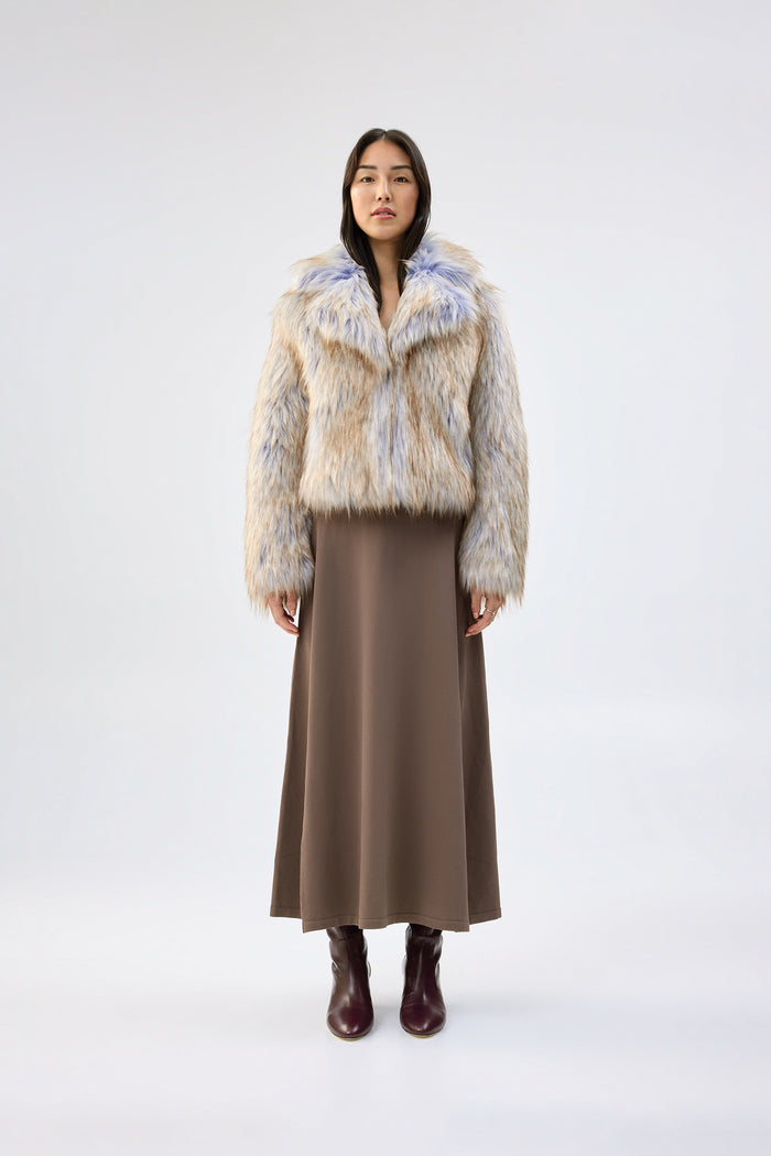Cream and blue faux fur jacket with notch lapel and cropped, boxy fit, worn over a brown maxi skirt, front view