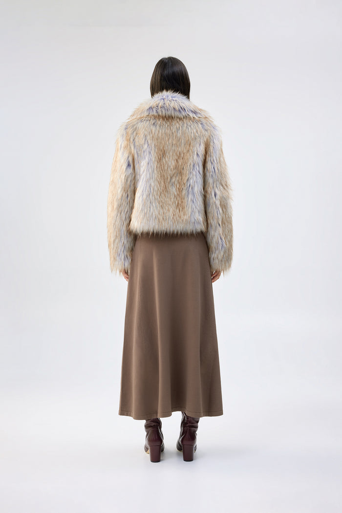 Cream and blue faux fur jacket with notch lapel and cropped, boxy fit, worn over a brown maxi skirt, back view