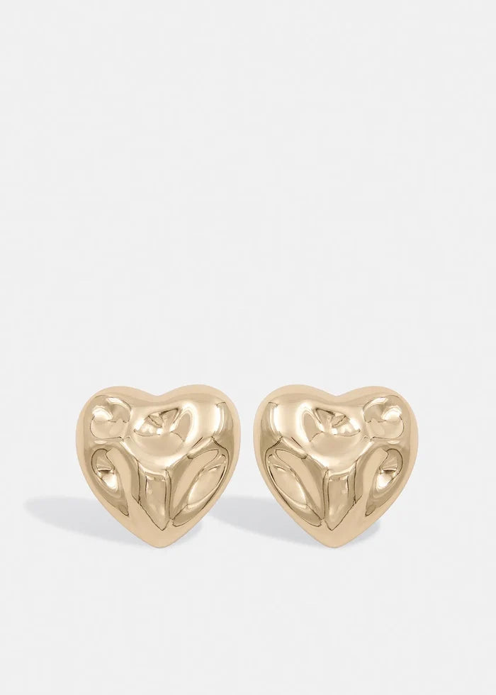 A pair of gold-tone metal earrings featuring two large, textured hearts.