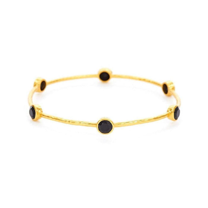 Gold bangle bracelet adorned with six black stones.