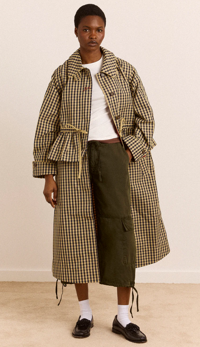 Woman wearing Damson Madder Myrtle Trench in Gingham against a white background