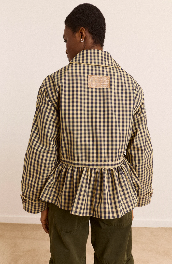 Woman wearing Damson Madder Myrtle Trench in Gingham against a white background back view