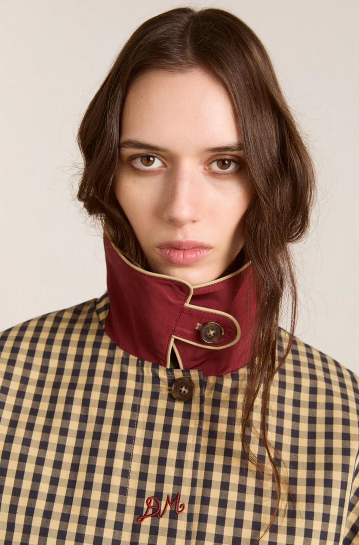 Woman wearing Damson Madder Myrtle Trench in Gingham against a white background close up view