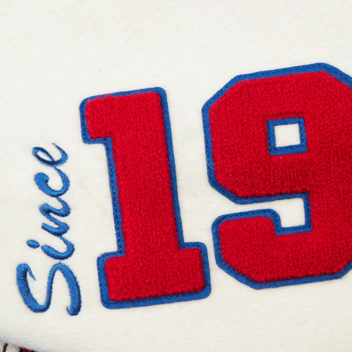 Up Close view of the "Since 19" patch in red lettering on the jacket's sleeve.
