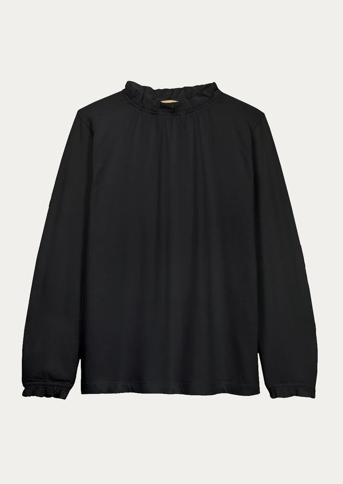 Black blouse with long sleeves on a light gray background