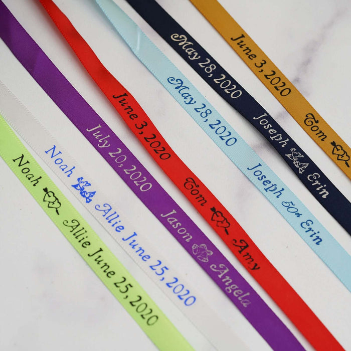 Personalized satin ribbons in various colors with names and dates.