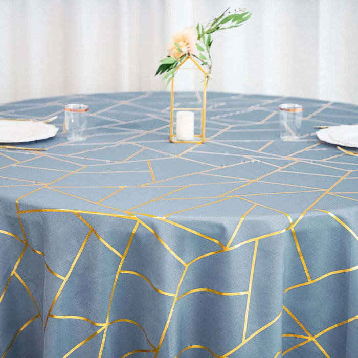 Elegant blue tablecloth with gold geometric design, perfect for events or dining.