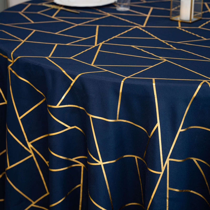 Navy tablecloth with gold geometric pattern design on a dining table.
