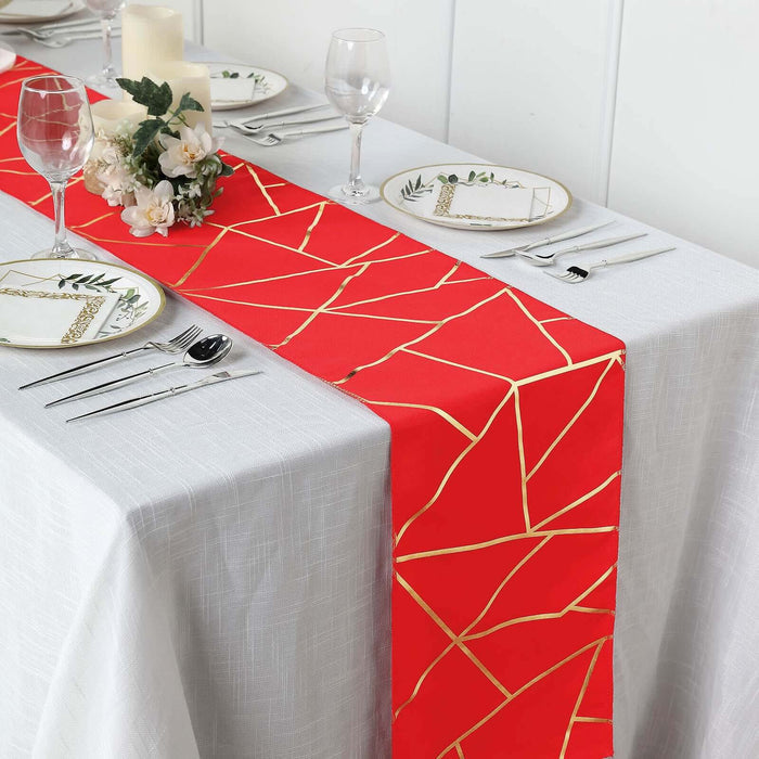 Red geometric table runner on a beautifully set dining table.