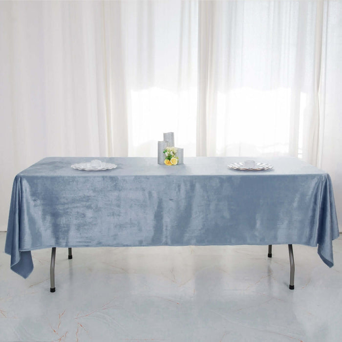 Elegant light blue tablecloth draped over a table with decorative centerpieces.