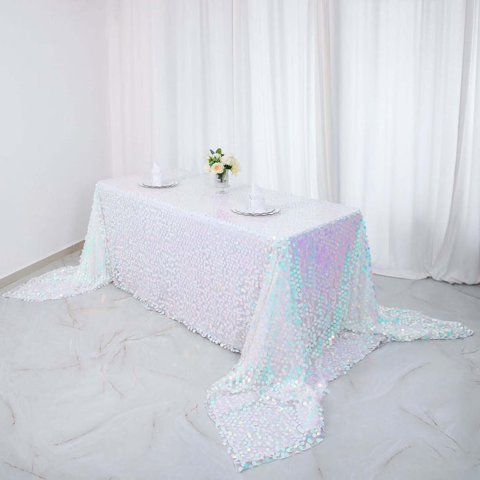Iridescent sequin tablecloth draped elegantly over a table in a bright setting.