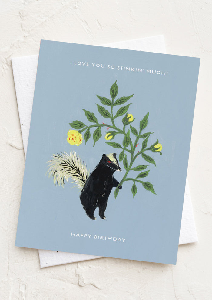 A skunk print card, text reads "I love you so stinkin' much! Happy birthday".