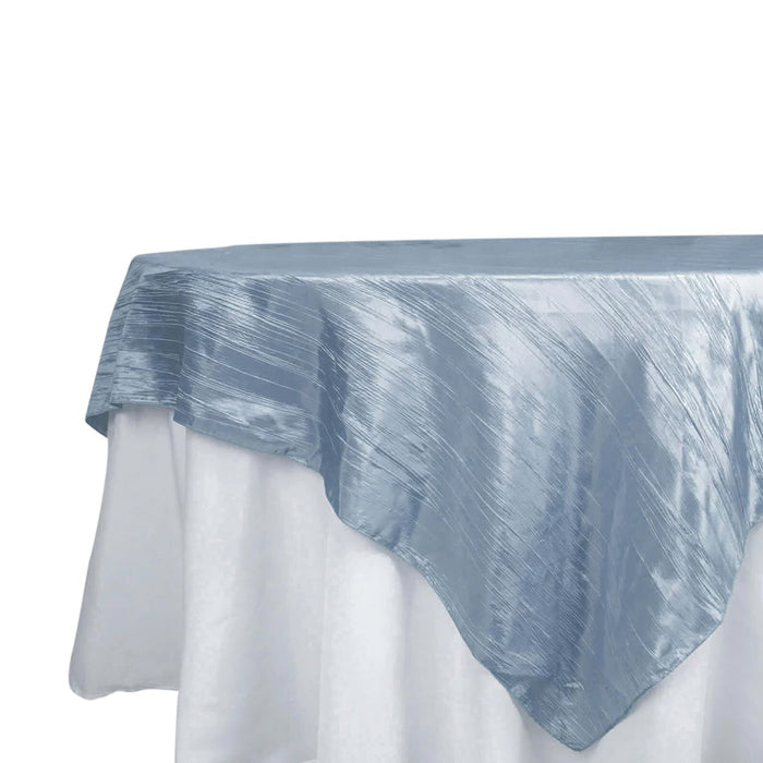 Blue satin tablecloth draped elegantly on a white table