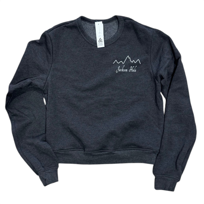 A gray sweatshirt with a mountain range design and the text 'Jackson Hole' on the front.
